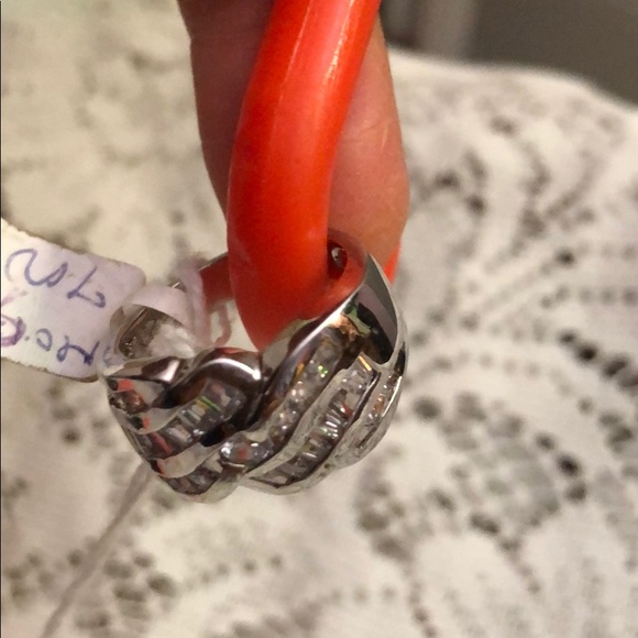 Ring Made of 9/5 Silver; and imitation diamond.